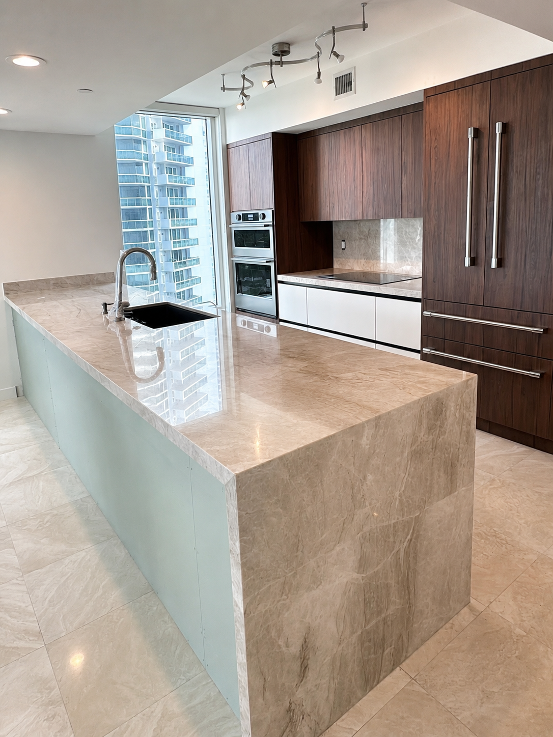 Luxury waterfall island countertop installation in South Florida