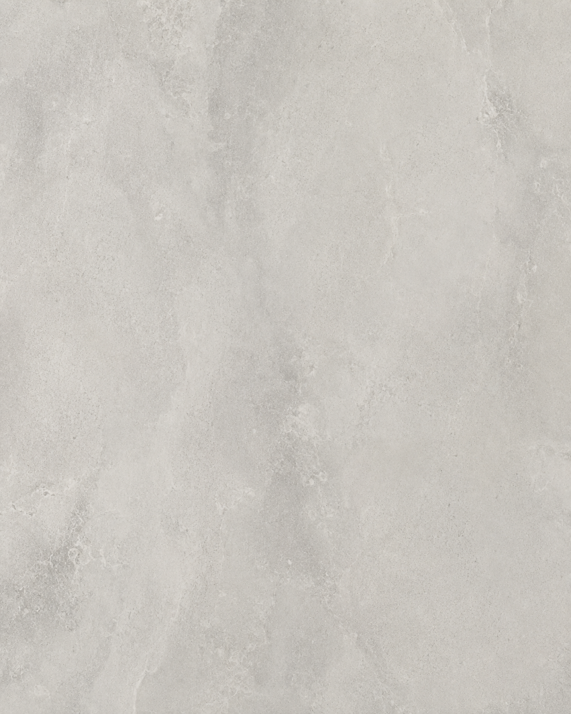 Close-up texture of Dekton light gray sintered stone featuring soft concrete-inspired movement, subtle tonal variation, and a contemporary ultra-compact surface designed for luxury kitchens, bathrooms, and architectural applications.
