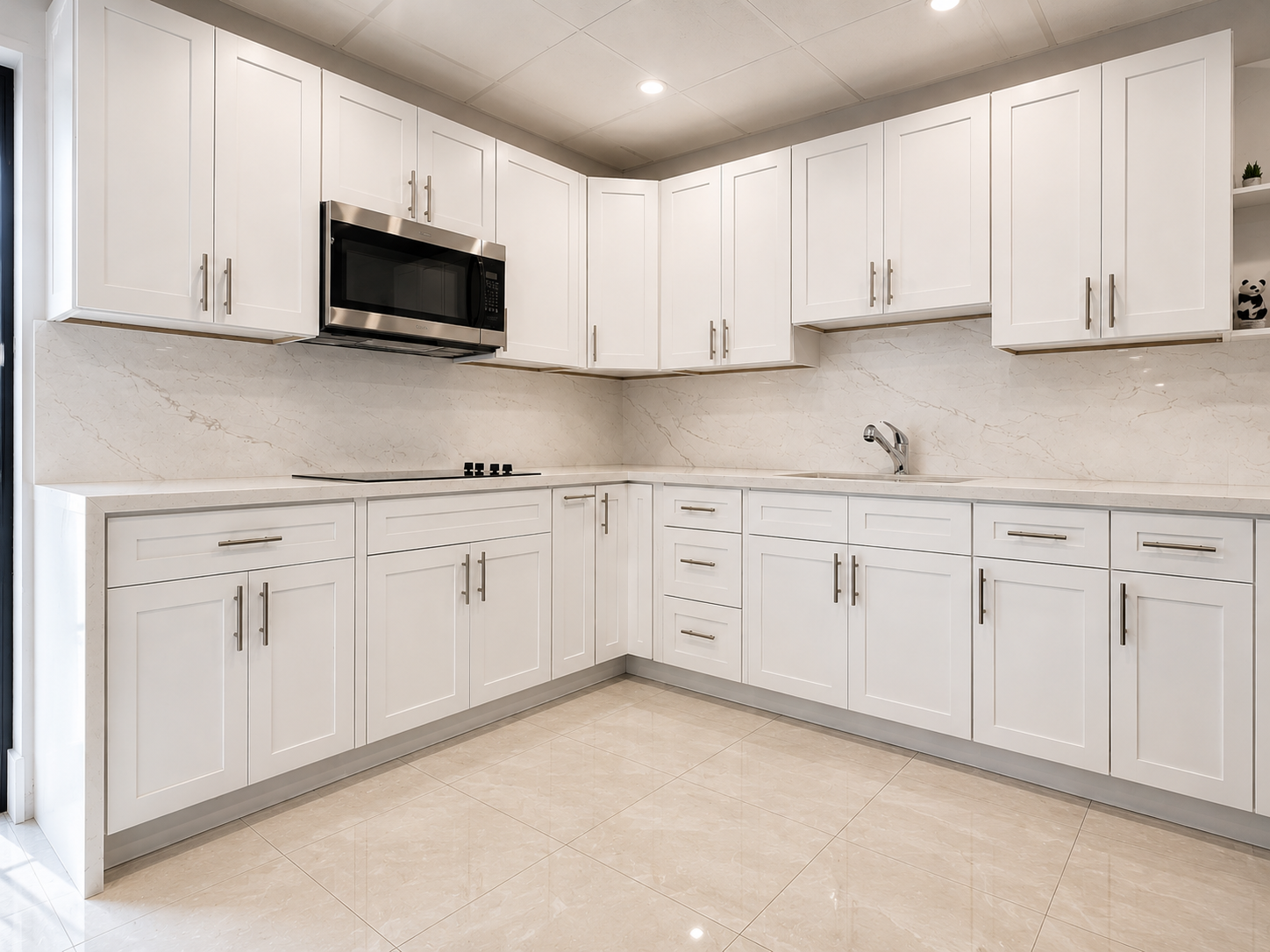 White shaker kitchen cabinets with matching Calacatta quartz countertops and full-height slab backsplash fabricated in-house by King of Quartz in South Florida.